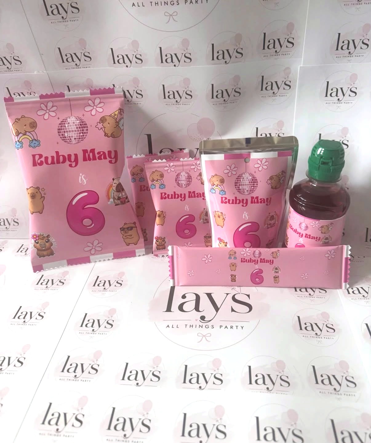 Personalised pink chip bags, pouch, drink bottle and chocolate bar for a 6th birthday